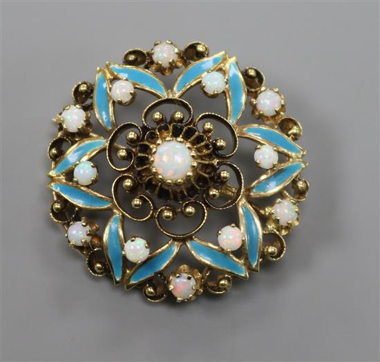 A yellow metal, white opal and blue enamel set openwork flowerhead brooch, 35mm.